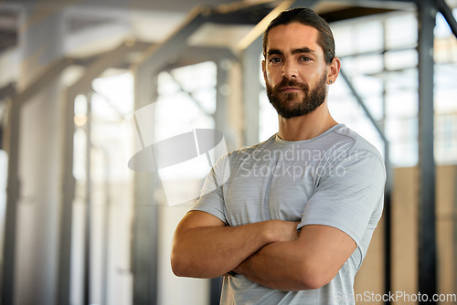 Image of Portrait of man in gym, mockup and arms crossed with fitness mindset, confidence and health tips. Workout, exercise and face of confident personal trainer at sports club with muscle and mock up space