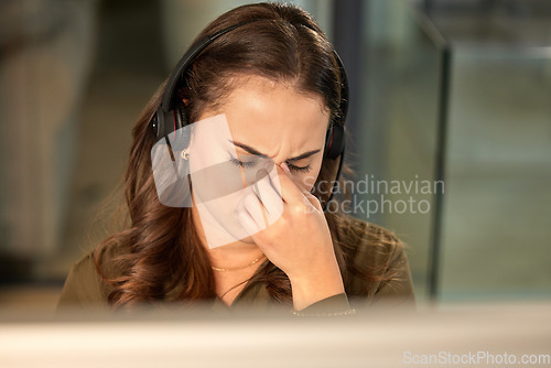 Image of Stress, call center and woman with a headache, telemarketing and overworked with burnout. Female person, consultant and agent with a migraine, anxiety and customer service with crm and tech support