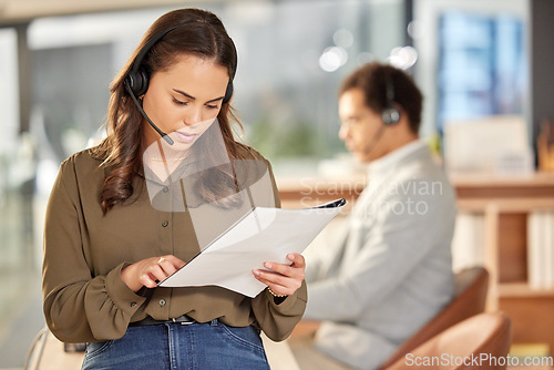 Image of Business woman, reading and call center paperwork with telemarketing and contact us data. Female worker, consultant and crm employee with notes on customer service and consulting job in office
