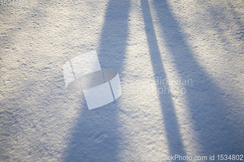 Image of shadows on wavy snowdrifts