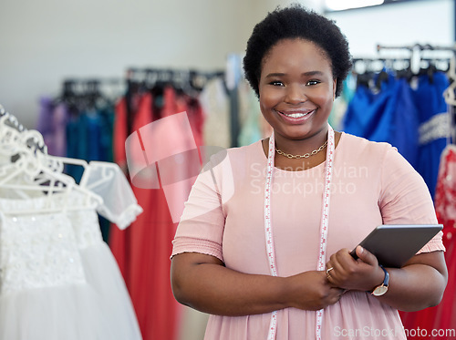 Image of Fashion, designer and tablet with portrait of black woman in boutique store for clothes, entrepreneur or creative. Small business, textile and seamstress with female employee for ecommerce and sewing