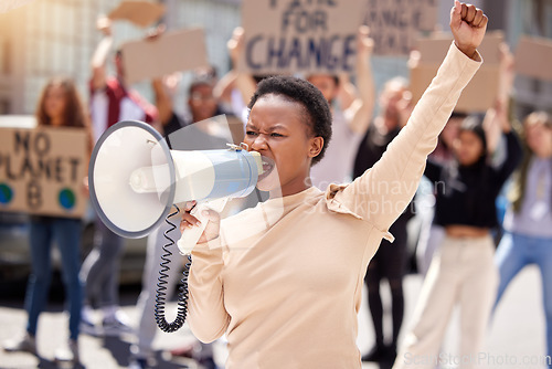Image of Justice, protest and black woman with megaphone and group shouting loud for justice due to government problem. Equality, angry and person fist up for politics fight or freedom with frustrated people