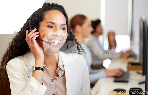 Image of Call center, agent and woman with telemarketing, smile and friendly with tech support, professional and advice. Staff, female person or happy employee with headphones, customer service and consulting