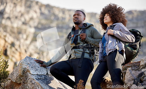 Image of Hiking, adventure and fitness with couple in mountains for journey, climbing and travel. Relax, trekking and environment with black man and woman hiker in nature for exercise, health and motivation