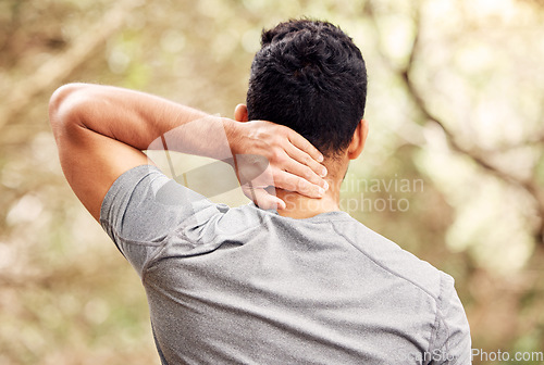 Image of Neck pain, fitness and man in nature for training, running or workout burnout, stress or accident in forest. Athlete, runner or person from behind, back or spine problem with healthcare risk in woods