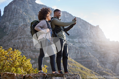 Image of Camera, fitness and couple hiking, view and exercise for wellness, health and cardio with happiness. Training, black man and woman with workout, picture and memory with a smile, hike and adventure