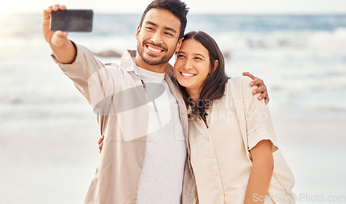 Image of Couple at beach, selfie and travel with happiness outdoor, romantic holiday in Mexico with social media post and love. Trust, care and commitment, man and woman smile in picture with ocean and memory