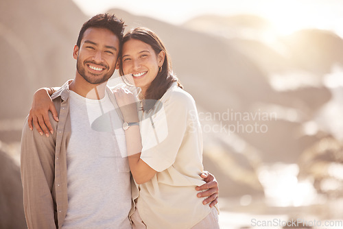 Image of Portrait, couple and holiday with hug at ocean with happiness in the summer on the weekend. Face, smile and man with woman at the beach for travel with the sunshine for bond together on a trip.