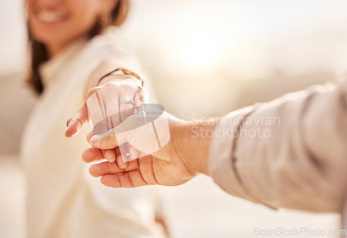 Image of Couple holding hands, engagement and ring, wedding proposal with love and commitment outdoor. Care, trust and relationship with people outside and marriage, life partner and closeup of jewelry