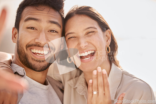 Image of Couple in selfie, proposal and engagement ring with love and commitment, happy in portrait with social media post. Face, man and woman with marriage, happiness and care, smile in picture with jewelry