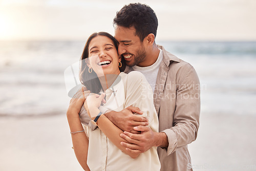 Image of Together, beach and happiness with hug on holiday for having fun with sunset for the weekend. Couple, vacation and laughing with face at the ocean for travel in the summer for a relaxing time.