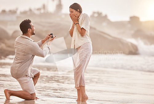 Image of Couple at beach, wow for proposal and engagement with love and commitment with ocean and people outdoor. Travel, mockup space and man propose marriage to woman, surprise and happiness with care