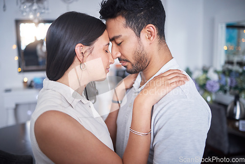 Image of Touching, bonding and couple with forehead together in communication of support, love or trust in partnership. People, forgive and hug after fight, conflict or date for healthy relationship and peace