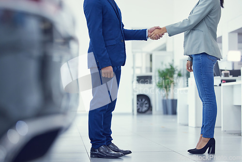 Image of Closeup, man and woman with handshake, collaboration and customer with negotiation, car dealership and selling. Zoom, business people or client shaking hands, agreement and professional with contract