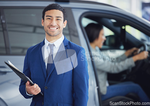 Image of Documents, portrait and car salesman smile at showroom, workshop or workplace. Face, clipboard and Asian person at dealership for motor vehicle shopping, business and sales manager in retail store.