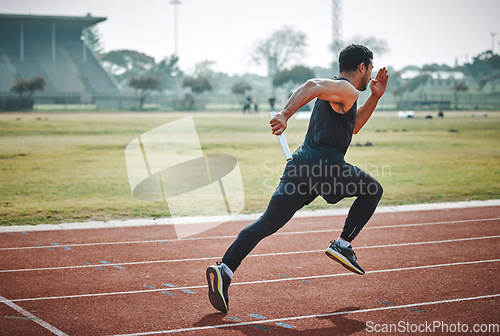 Image of Stadium, man relay running and athlete on a runner and arena track for sprint race training. Fast, run and sports exercise of a male person in marathon for fitness and workout outdoor on a field