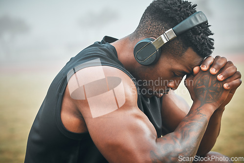 Image of Music, training and thinking with black man in park for exercise, strong and motivation. Streaming, sports podcast and radio with male athlete and headphones for muscle, workout and challenge