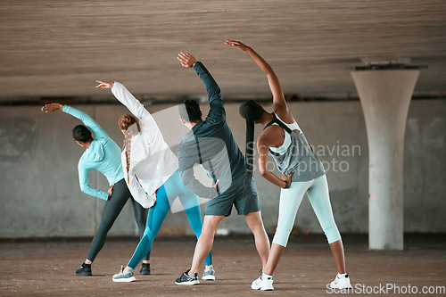 Image of Team, yoga and people stretching as a wellness club for sports, health and fitness body in an urban class together. Sport, commitment and friends training or group doing pilates exercise or workout