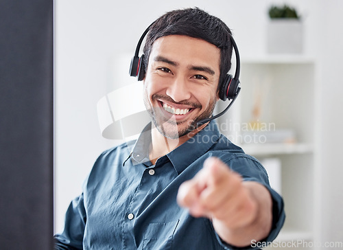 Image of Call center, pointing and portrait of man in office for consulting, communication and customer service. Motivation, support and contact us with male employee for advice, sales or telemarketing choice