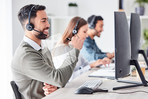 Image of Man, call center and working in team office with headset, computer for online customer support, service or help. Businessman, employee and job in crm, telemarketing or communication help desk