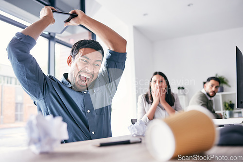 Image of Angry, hitting and business man in office for anger management problem, mental health and frustrated. Shout, technology and burnout or stress of professional person with employees fear and shocked