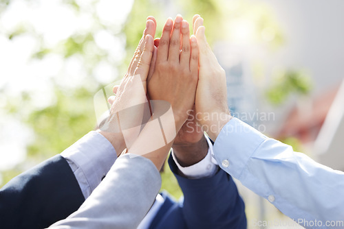 Image of High five, team building or hands of business people outside in collaboration for mission goals or support. Closeup, motivation or employees meeting with goals or teamwork winning together outdoors