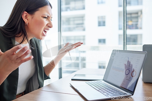 Image of Mental health, businesswoman angry and with laptop at her desk in her workplace office. Stress or anxiety, problem or mistake and female person frustrated with data review in her workspace with pc