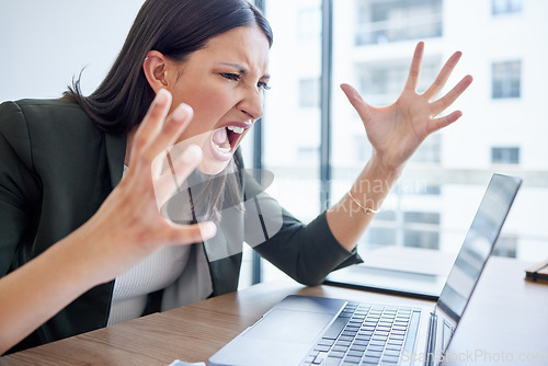 Image of Mental health, businesswoman screaming at laptop and at her desk in her office workplace. Stress or frustrated, angry and female person shout at pc for data review or feedback at her workstation