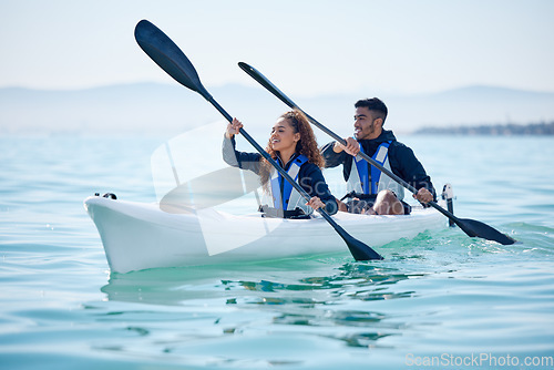 Image of Kayak, couple and rowing boat on lake, ocean or river for water sports and fitness challenge. Man and woman with a paddle for adventure, exercise or travel in nature with freedom, energy and teamwork