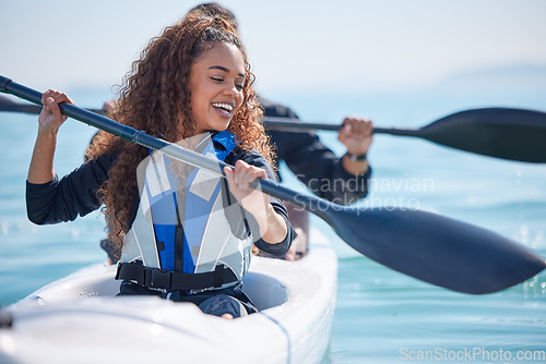 Image of Kayak, woman and rowing boat on lake, ocean or river for water sports and fitness challenge. African girl and partner with paddle for adventure, exercise or travel in nature with freedom and teamwork