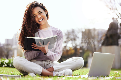 Image of Woman on lawn, laptop and notebook, college student on campus and studying course material and education. Happy female person in outdoor portrait, learn and study online notes on pc with scholarship