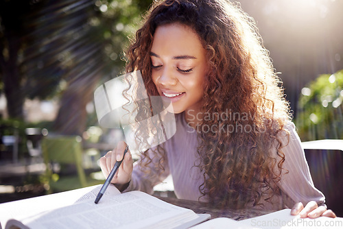 Image of Reading, studying and woman with books outdoor in park, cafe or university campus, notes and exam goals. Planning, knowledge and african person or college student for remote work and scholarship