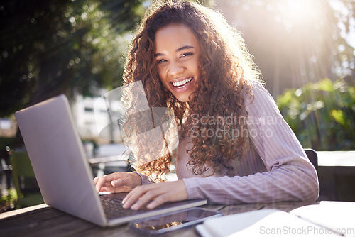 Image of Portrait, woman and student with a laptop, outdoor and typing with a smile, connection and online reading. Face, female person or girl in a cafe, pc or technology with education, email and university