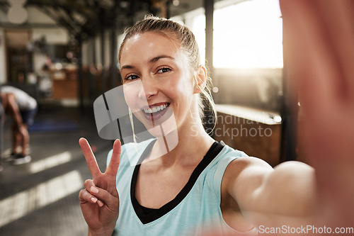 Image of Peace sign, fitness and selfie with woman in gym for workout, health and exercise. Social media, picture and smile with portrait of female bodybuilder training for sports, wellness and blogger