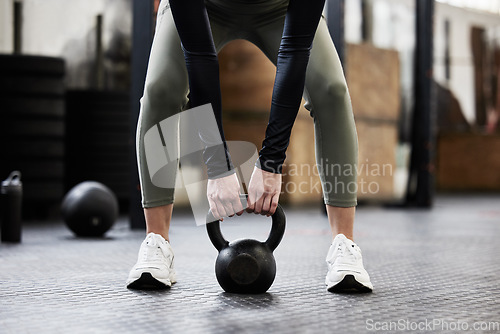 Image of Kettle bell, fitness and woman in gym for weightlifting, bodybuilder training and strong muscles. Healthy body, weights and hands of female person in sport center for wellness, exercise and workout