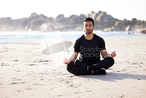 Image of Freedom, man sitting on the beach and meditation for peace of mind during summer. Relax or harmony meditating, mental health and male person on the sea sand for health wellness in fresh air outdoors