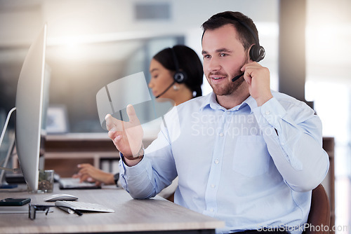 Image of Call center, consulting and business man in office for communication, customer service or help desk. Telemarketing, sales and advice with male employee for commitment, contact us and hotline