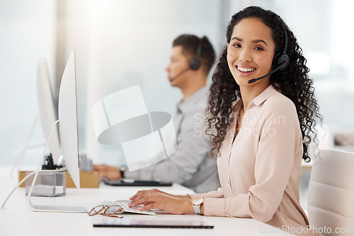 Image of Portrait, call center and computer with a woman consultant working in her office for support or assistance. Customer service, contact us or crm with a happy female employee consulting using a headset