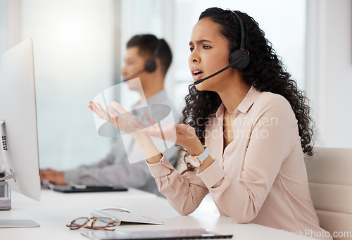 Image of Frustrated woman, call center and consulting on computer in customer service, support or telemarketing at the office. Upset female person or consultant agent talking to difficult client at workplace