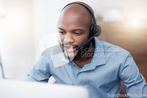 Image of Black man, call center worker and CRM with contact us, communication and computer, headset with mic and connect. Male consultant, customer service and tech support with help desk employee in office