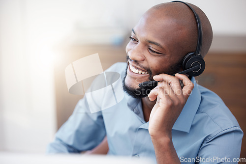 Image of Call center, black man and happy agent working on computer in the office, business in telemarketing or customer service. Businessman, face with smile and crm, conversation with client on help desk