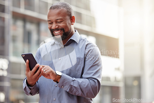 Image of Phone, text message a senior business black man in the city, typing an email while commuting to work. Mobile, contact and social media with a happy mature male employee networking in an urban town