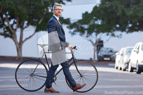 Image of Bike, morning and business man in city for carbon neutral, commute and environment. Professional, executive and sustainability with employee and bicycle in outdoors for cycling, natural and health