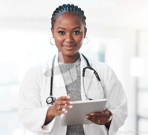 Image of Portrait, tablet and healthcare with a doctor black woman in the hospital for insurance or research. Medical, trust and technology with a young female medicine professional or consultant in a clinic