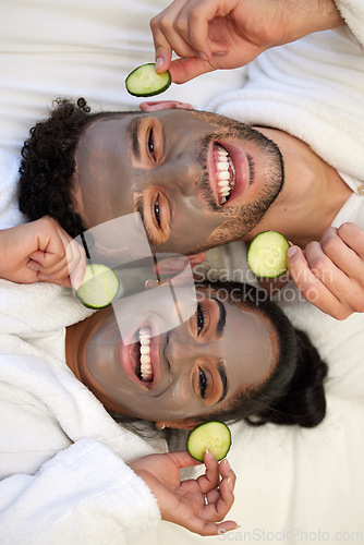 Image of Facial, spa and smile with portrait of couple for skincare, cosmetics and detox from above. Beauty, relax and self care with man and woman with clay mask at home for salon, wellness and cucumber