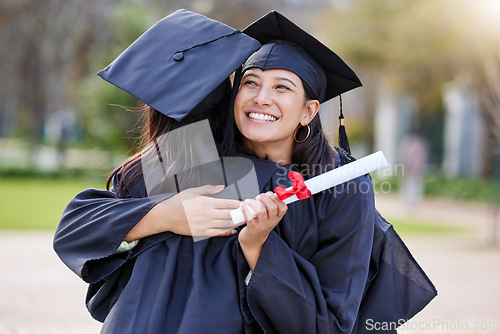 Image of Graduate, education and woman friends hugging at a university event on campus for celebration. Graduation, certificate and hug with female students together in support of a scholarship achievement