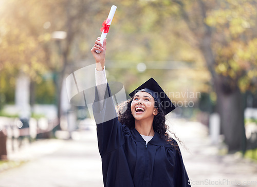 Image of Success, university woman graduate and celebration outdoors with her certificate. Achievement or victory, college and happy student cheering for education on her graduation day with a lens flare