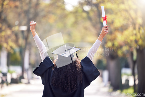 Image of Graduation, back and woman student celebrating academic success or raising her diploma or victory at university campus with cheers. Motivation, certificate and achievement for happy female person