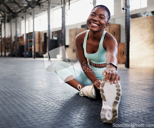 Image of Fitness, portrait or black woman stretching legs for gym workout routine or body movement for wellness Happy, athlete or healthy girl smiling in exercise training warm up for flexibility or mobility