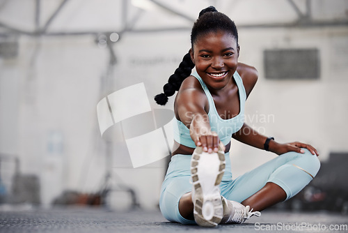 Image of Gym, portrait or black woman stretching legs for workout routine or body movement for active fitness. Happy, athlete or healthy girl smiling in exercise training warm up for flexibility or mobility